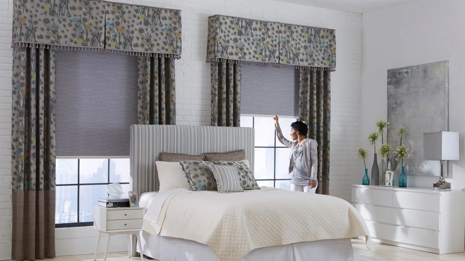 Full length grommet draperies framing a dining room window wall onto a garden